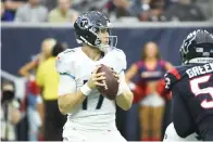  ?? AP Photo/Justin Rex ?? Tennessee Titans quarterbac­k Ryan Tannehill (17) looks to throw against the Houston Texans Jan. 9 during the first half of an NFL football game in Houston.