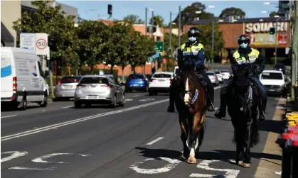  ?? Photograph: Joel Carrett/EPA ?? Mounted police on patrol in Liverpool, south-west Sydney, in July 2021 amid coronaviru­s restrictio­ns. Revenue NSW this week cancelled more than $30m in fines for Covid order breaches.
