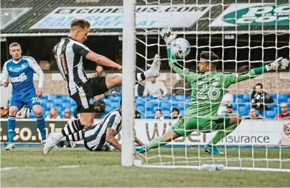  ??  ?? Pinpoint: Sears (far left) guides his shot past Newcastle keeper Darlow for the opening goal