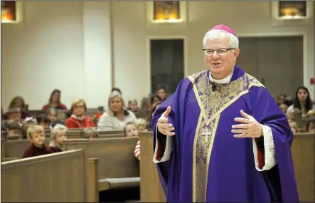  ?? (Special to the Democrat-Gazette/Aprille Hanson via Arkansas Catholic) ?? Bishop-elect Francis Malone delivers a homily during his farewell Mass for students at Christ the King School in Little Rock on Dec. 20.