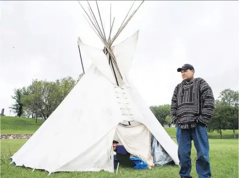  ?? KAYLE NEIS ?? Chris Martell stands in front of a teepee at the Healing Camp for Justice in Saskatoon’s Victoria Park on Wednesday. Martell, whose son Evander Daniels drowned in a bathtub at a foster home in 2010, says he wants to draw attention to the foster-care...