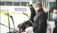  ?? Jeff Toates / Associated Press ?? Stars interim head coach Rick Bowness watches practice in Frisco, Texas, on Tuesday. Bowness, 65, coached from behind the bench the first couple of days of training camp before lacing up his skates and getting on the ice.