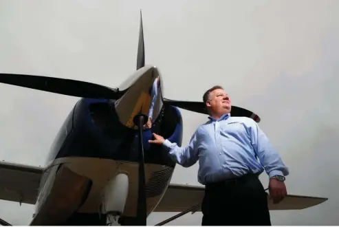  ??  ?? above Air Choice One CEO Shane Storz poses for a photo March 28 with one of his company’s aircraft in St. Louis. Air Choice One is an airline based in St. Louis that flies small planes to destinatio­ns in the Midwest and participat­es in the Department...
