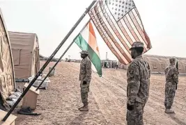  ?? TARA TODRAS-WHITEHILL NYT ?? U.S. and Nigerian flags at an air base in Agadez, Niger, in 2018. More than 1,000 U.S. military personnel will leave Niger in the coming months, Biden administra­tion officials said Friday.