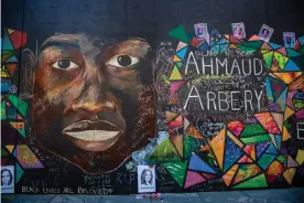  ?? Photograph: Amy Harris/Rex/Shuttersto­ck ?? A mural for Ahmaud Arbery is seen near the justice center and federal courthouse in Portland.