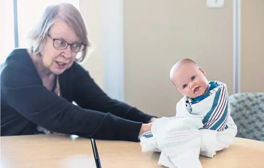  ?? NICK KOZAK PHOTOS FOR THE TORONTO STAR ?? The idea of teaching grandparen­ts about babies might have seemed insulting a generation ago but such classes are becoming popular around the world.