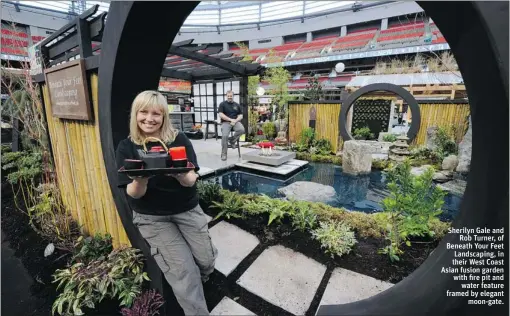  ?? PHOTOS BY MARK VAN MANEN / PNG ?? Sherilyn Gale and
Rob Turner, of Beneath Your Feet Landscapin­g, in their West Coast Asian fusion garden with fire pit and
water feature framed by elegant
moon- gate.