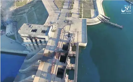  ?? AP Photo ?? Drone footage shows the exterior of the Tabqa dam is intact, although its power supply may have been knocked out in fighting.