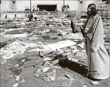  ?? JOHNNY NICKLAS/THE PALM BEACH POST ?? Scenes of mud, music and hippies at the 1969 Thanksgivi­ng weekend rock festival at the Palm Beach Internatio­nal Speedway.