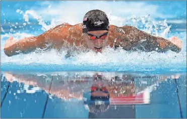  ?? Clive Rose/Getty Images AsiaPac/TNS ?? The United States’ Caeleb Dressel competes in the Men’s 100m Butterfly Final at Tokyo Aquatics Centre on Saturday, July 31 in Tokyo. Dressel won two more gold Sunday to finish out the swim competitio­n with five gold medals.