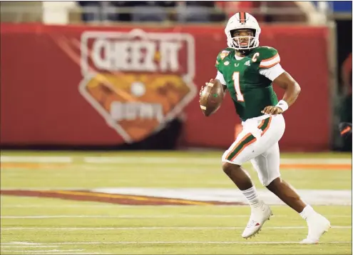  ?? John Raoux / Associated Press ?? Miami quarterbac­k D’Eriq King throws a pass during the first half of the Cheez-it Bowl against Oklahoma State on Tuesday.