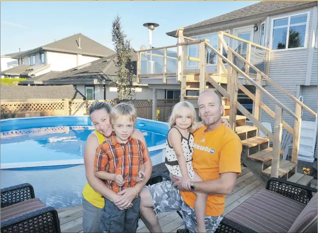  ??  ?? Shannon and Mike Jijian and their children — Tre, 7, and Taryn, 4 — couldn’t be happier with their new backyard. ‘ It’s like I am in a resort. It’s a complete escape. I love it,’ Mike says.