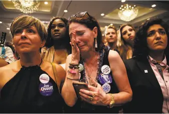  ?? David Goldman / Associated Press ?? Supporter Jan Yanes sobs as Jon Ossoff, Democratic candidate for Georgia’s Sixth Congressio­nal District, who doesn’t even live in the district, concedes to Republican Karen Handel.