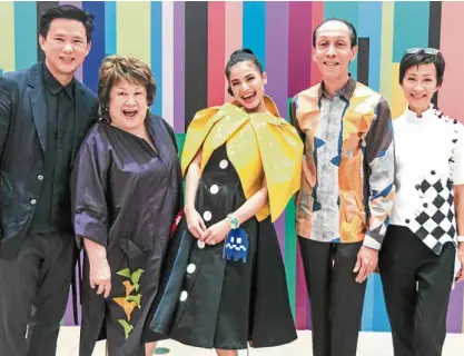  ?? —PHOTOS BY LEO SABANGAN ?? Steven Tan, COO of Shopping Center Management Corp., SM Supermalls; Swatch president Virgie Ramos; actress Anne Curtis in a dress and Pac-Man-inspired cape by Claire Francisco; Mark and Sandy Higgins of Slim’s Fashion &amp; Arts School