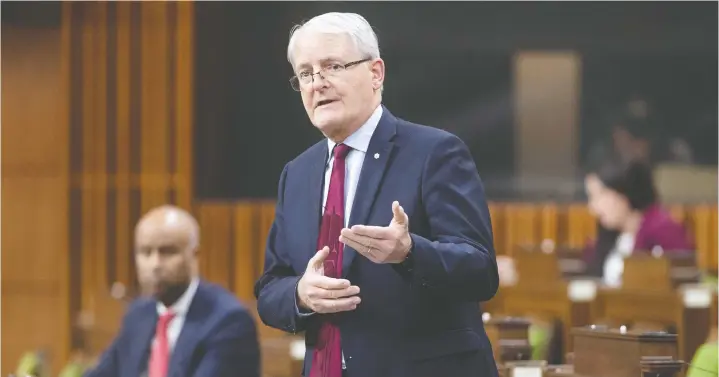  ?? — THE CANADIAN PRESS ?? Federal Transport Minister Marc Garneau says airlines have been financiall­y devastated by the pandemic and he’s trying to keep them from collapsing.