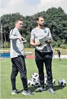  ??  ?? Talking tactics: Gareth Southgate confers with Steve Holland (left)