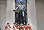  ?? SPENCER PLATT/GETTY IMAGES ?? Members of the New Jersey Fifes and Drums perform 18th century music on the steps of the Federal Hall National Memorial on April 30, 2019 in New York City. At Federal Hall on Wall Street members of the National Park Service, historians, reenactors and others celebrated the 230th anniversar­y of George Washington’s inaugurati­on which took place at the location.