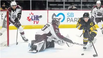  ?? CATHIE COWARD THE HAMILTON SPECTATOR ?? Giordano Biondi manoeuvres around Peterborou­gh goalie Michael Simpson and fires in Hamilton’s first goal of Game 2, won 5-2 by the Bulldogs, giving them a 2-0 series lead.