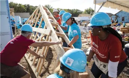  ?? Photograph: Jason Asteros/AP ?? Volunteers for Habitat for Humanity Internatio­nal work on a house in Nashville in 2019.