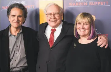  ?? Charles Sykes / Invision ?? Peter Buffett, with father Warren and sister Susie, founded the NoVo Foundation with wife Jennifer.