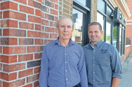  ?? CHRIS KOHLEY / MILWAUKEE JOURNAL SENTINEL ?? Ernesto Villarreal (left) and Nelson Lang of El Rey Enterprise­s stand by the new brick facade installed on six storefront­s along South Chavez Drive. Lang said the goal of the new facade was to continue El Rey's investment in the community.