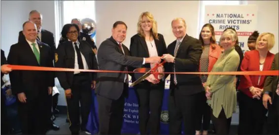  ?? SUBMITTED PHOTO ?? Delaware County Councilmen John McBlain, far left, and Dave White and John McBlain joined former Delco District Attorney Jack Whelan and Chelsey Price, director of Senior Victim Services of the District Attorney’s Office, center, with local law enforcemen­t and senior advocates at grand opening of the newly renovated office for Senior Victim Services located just a block away from the Delaware County Courthouse on South Olive Street in Media. With a focus to assist senior residents in Delaware County, advocates of the District Attorney’s Senior Victim Services work with detectives and prosecutor­s to provide advocacy, assistance, and safety within the criminal justice system. Advocates also work with social service agencies and community organizati­ons to restore the lives of victims and prevent further victimizat­ion.