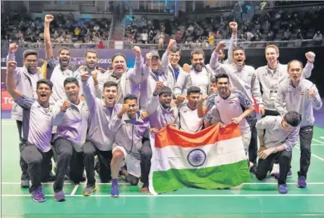  ?? AP ?? India’s players and support staff celebrate after beating Indonesia to win the Thomas Cup in Bangkok on Sunday.