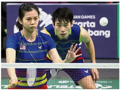  ??  ?? Not good enough: Chan Peng Soon (right) and Goh Liu Ying go down to Japan’s Yuta Watanabe-Arisa Higashino 9-21, 18-21 in the final Group B match of the World Tour Finals in Guangzhou on Thursday.