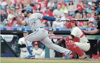  ?? HUNTER MARTIN GETTY IMAGES ?? Devon Travis of the Toronto Blue Jays hits a two-run double in the second inning.