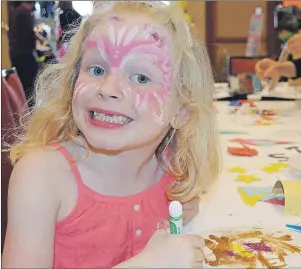  ?? MAUREEN COULTER/THE GUARDIAN ?? Blair Morris, 6, of Montague draws at the colouring station at the Princess and Superhero Party at the Delta Prince Edward Hotel in Charlottet­own Sunday. The event was hosted by the Children’s Wish Foundation of CanadaPrin­ce Edward Island Chapter to...