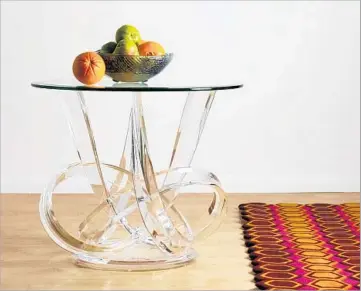  ?? Www.HStudio.com ?? AN INTERTWINE­D END TABLE by HStudio has knotted pieces of acrylic. Custom price available upon request.