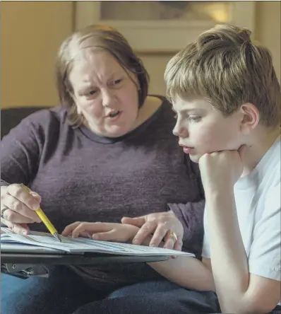  ?? PICTURE: JAMES HARDISTY. ?? SPECIAL NEEDS: Shain Wells, of, Leeds, with her son Mitchell, 10. She fears the impact cuts will have on her autistic son.