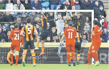  ??  ?? Liverpool’s Simon Mignolet makes a save before Hull City’s Alfred N’Diaye (hidden) scores their first goal during the English Premier League match between Hull City and Liverpool at The Kingston Communicat­ions Stadium. — Reuters photo