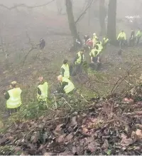  ??  ?? ●●Members of the Friends of Ashworth Valley hard at work in the beauty spot