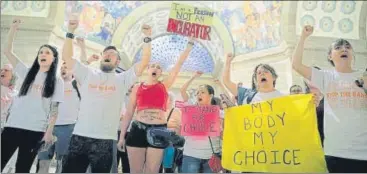  ?? AP ?? ▪ Abortion-rights activists react after lawmakers approved a sweeping piece of anti-abortion legislatio­n in the state of Missouri.