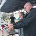  ?? POLITICAL BLIND DATE ?? Toronto Liberal MP Marco Mendicino, background, shoots only pictures at a shooting range, as Conservati­ve MP Glen Motz gets in some practice.