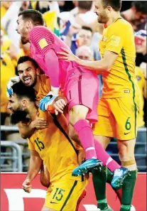  ??  ?? PIGGY BACK: Mile Jedinak is mobbed by his team-mates