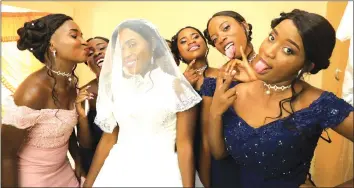  ??  ?? Ernet Mbedzi and her bridal team pose for a photograph during her wedding in Chitungwiz­a recently. by Innocent Makawa) - (Picture