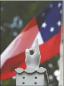  ?? (Northwest Florida Daily News/Devon Ravine) ?? A memorial and the first Confederat­e national flag are displayed June 19 on the grounds of the Walton County Courthouse in DeFuniak Springs, Fla. While the Confederat­e battle flag with its familiar blue X design is the best known of the flags of the Confederac­y, the nation had other flags that generally aren’t the subject of controvers­y.