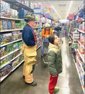  ?? Photo by Beth Koop ?? Both Elk County law enforcemen­t and fire department­s helped in this year’s Shop with a First Responder event on Wednesday evening.