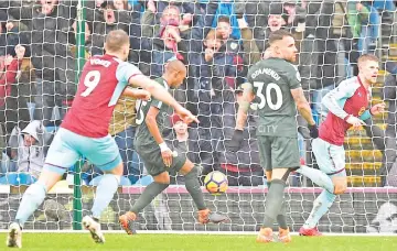  ?? Photo — AFP ?? Burnley's Icelandic midfielder Johann Berg Gudmundsso­n (R) celebrates scoring their first goal to equalise 1-1 during the English Premier League football match between Burnley and Manchester City at Turf Moor in Burnley, north west England on February...