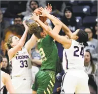  ?? Stephen Dunn / Associated Press ?? UConn’s Katie Lou Samuelson, left, and Napheesa Collier defend against South Florida’s Tamara Henshaw in Sunday’s game at Gampel Pavilion in Storrs.