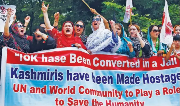  ?? Associated Press ?? ↑ Supporters of Jammu Kashmir Islamic Political Party shout anti-india slogans in Islamabad on Monday.
