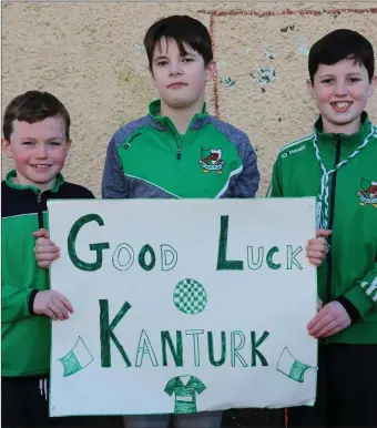  ??  ?? Eyes on the prize: Dara Browne, Callum Marwood and Ronan Harrington supporting the Kanturk team at St. Colman’s National School