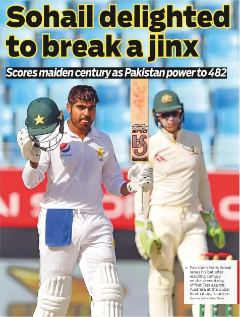  ?? Virendra Saklani/Gulf News ?? Pakistan’s Haris Sohail raises his bat after reaching century on the second day of first Test against Australia at the Dubai Internatio­nal stadium.