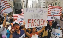  ?? AGENCE FRANCEPRES­SE VIA GETTY IMAGES ?? Protesters gather near Trump Tower in New York during a demonstrat­ion Tuesday against attacks on immigrants under the policies of President Donald Trump.