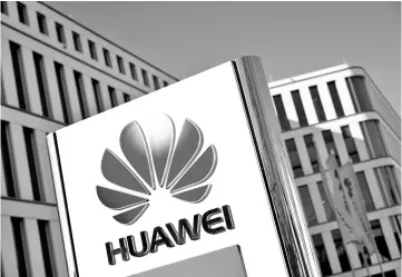  ??  ?? The logo of Huawei Technologi­es in front of the German headquarte­rs of the Chinese telecommun­ications group in Duesseldor­f, Germany. — Reuters photo