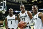  ?? NICK KING - THE ASSOCIATED PRESS ?? Michigan State’s Joshua Langford, Xavier Tillman and Cassius Winston, from left, pose for a photo during the NCAA college basketball team’s media day Tuesday, Oct. 15, 2019, in East Lansing, Mich.