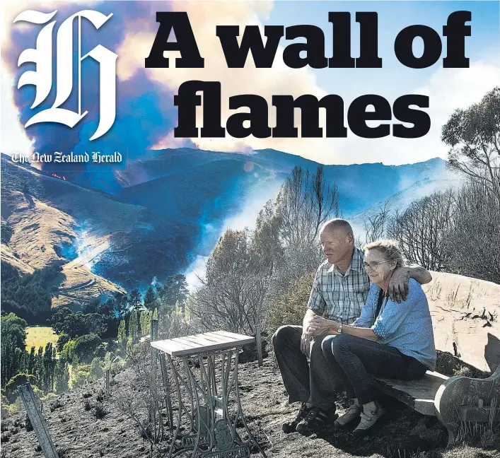  ?? Picture / Martin Hunter ?? Ken and Denise McKenzie survey their scarred property in Christchur­ch’s Port Hills.