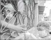  ??  ?? A Peruvian health worker takes a Covid-19 test of a man in his house in Lima.